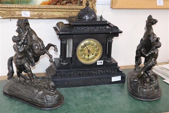 A Victorian black slate mantel clock and a pair of spelter Marly horses